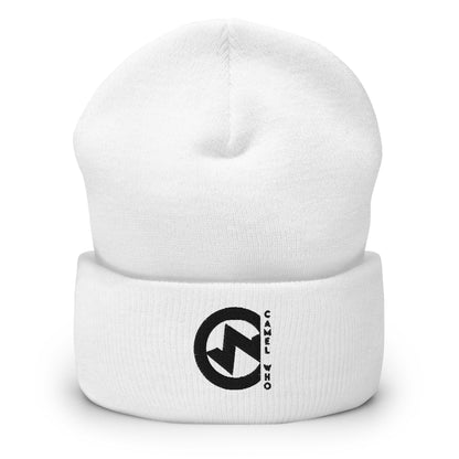 Soft organic white beanie with durable black circular logo patch and fold-over cuff.
